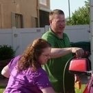 Mark and his wife Tina washing the car